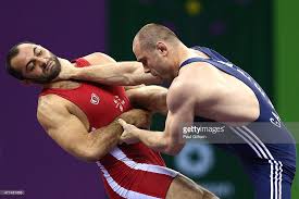 Imposing Khetag Gazyumov of Azerbaijan awaits Kyle Snyder in the Olympic Gold medal match.  Courtesy, Gettyimages